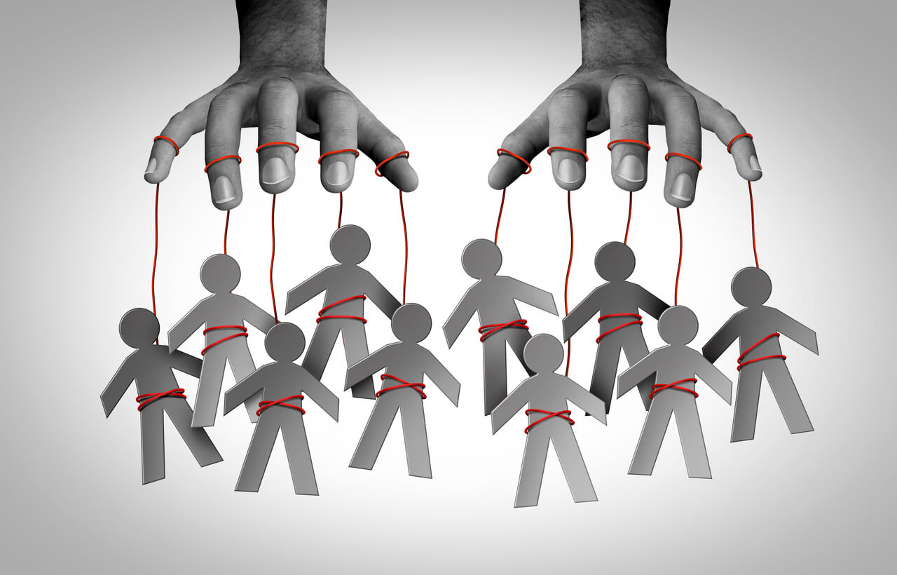 Trauma bonding illustrated: grey paper figures tied by red strings to a pair of hands above them